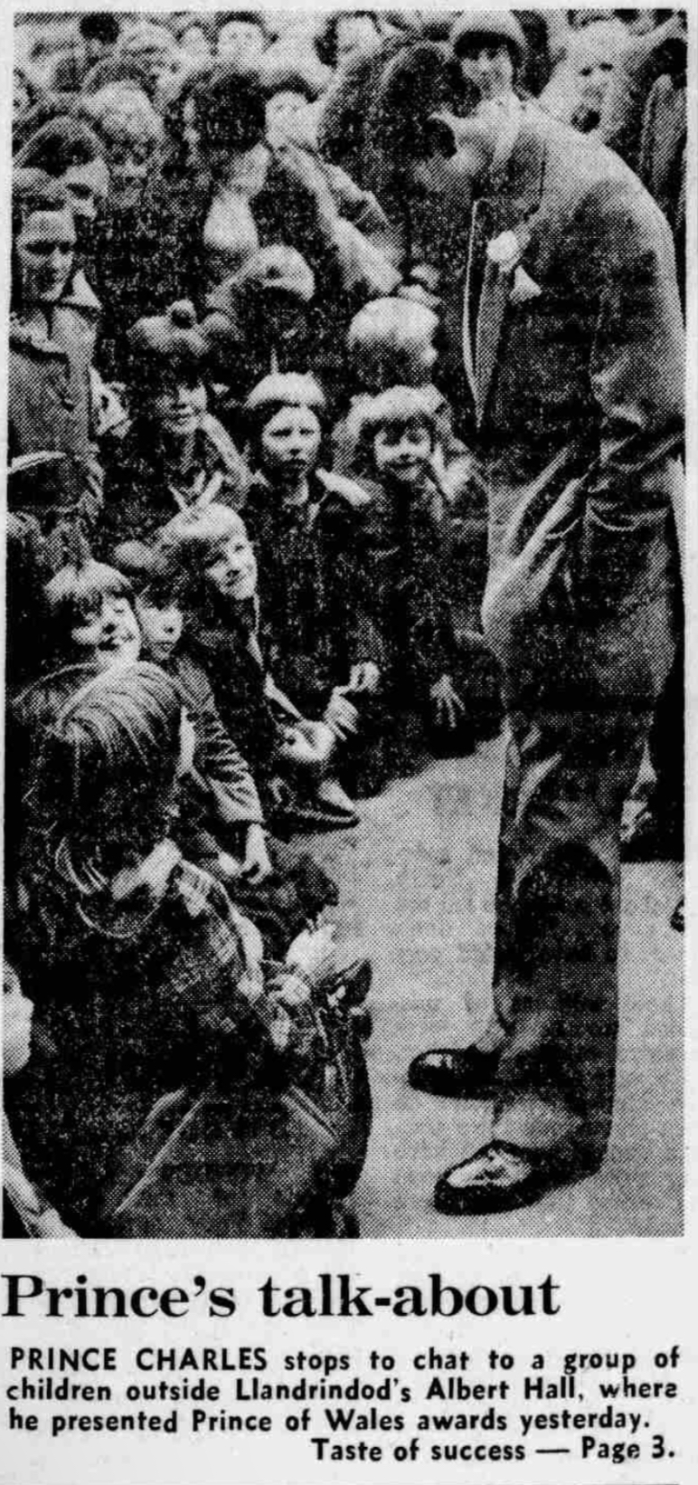 A Newspaper cutting from 1979 stating: Prince's talk-about PRINCE CHARLES stops to chat to a group of children outside Llanndrindod's Albert Hall, where he presented Prince of Wales Awards yesterday.